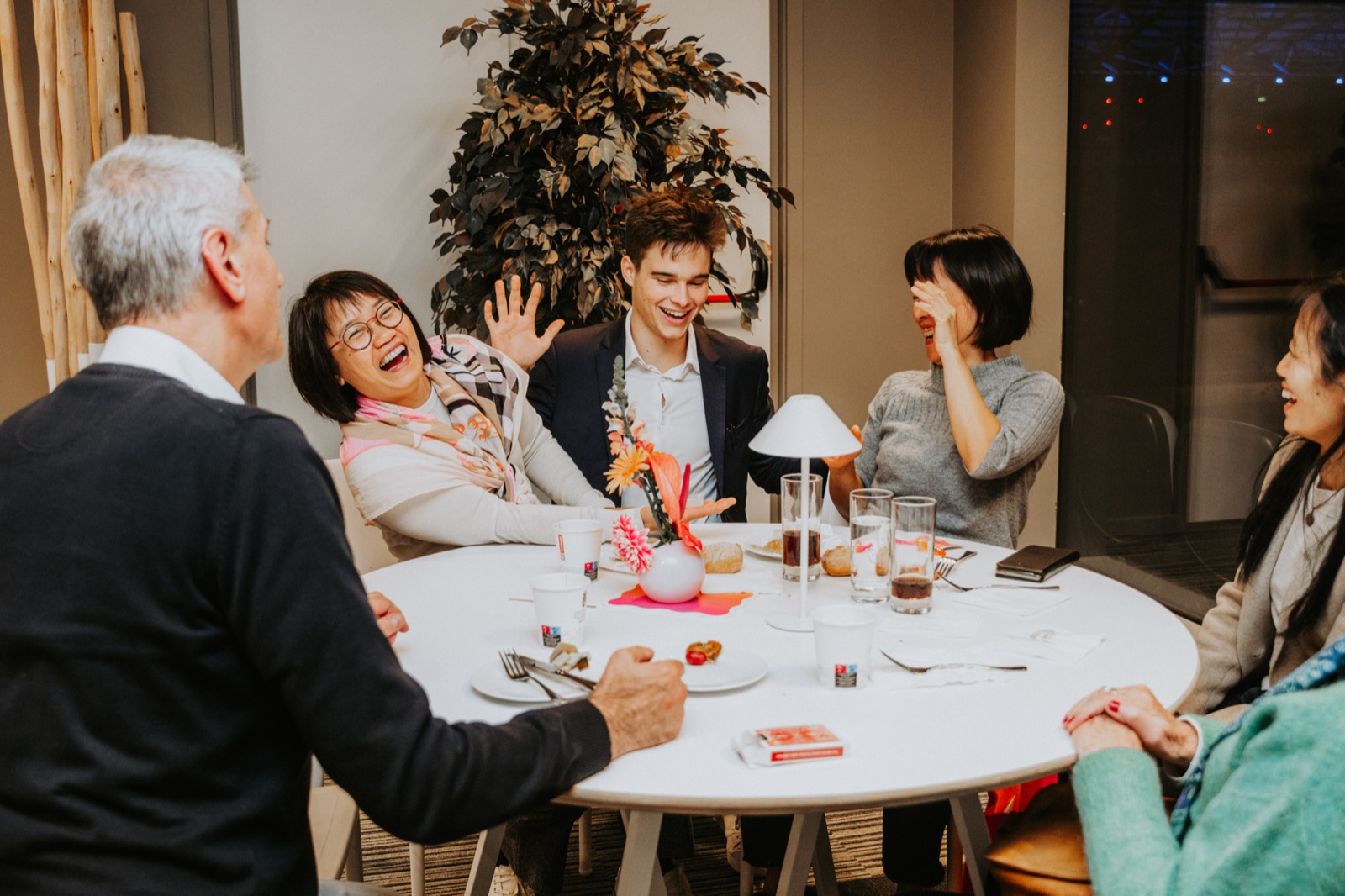 Guests applauding and laughing at a corporate evening reception