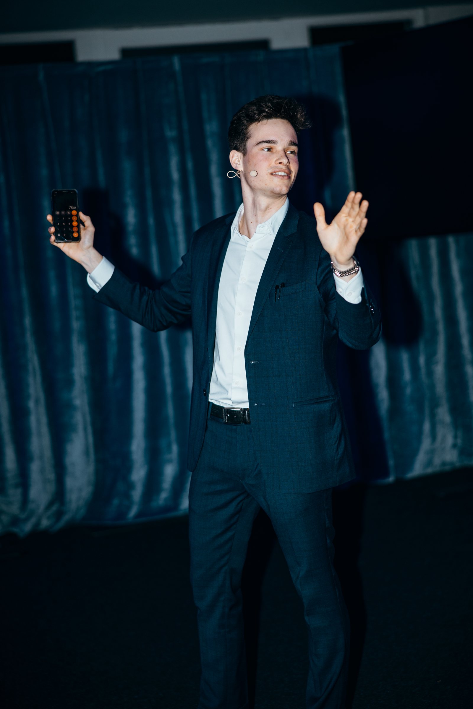 Jonas De Bruyn on stage at a conference